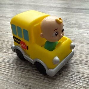 CoComelon Mini Vehicle School Bus toy featuring the character JJ